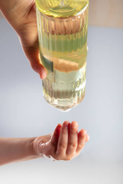 istock Use cologne alcohol for disinfection to viruses. Put cologne alcohol to clean hands. 1212833652