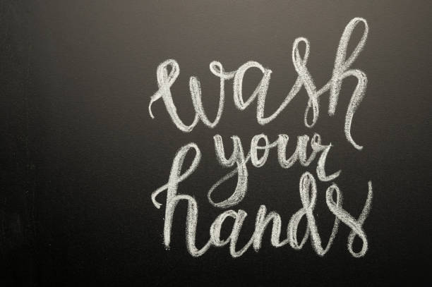istock Coronavirus. Danger. Caring for cleanliness. Writing on the board - wash your hands. With space for inscription or design. 1212833903