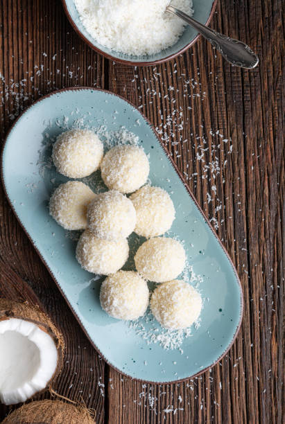 istock Delicious no bake candy, white chocolate truffles covered in shredded coconut 1212834584