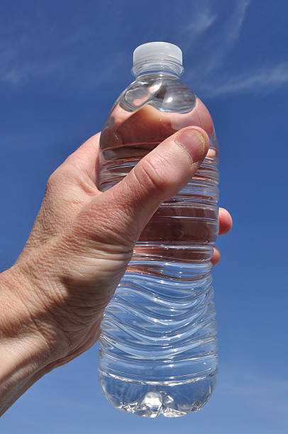 istock Hand Holding a Bottle of Water 121283464