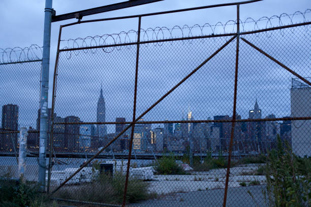 istock Manhattan Skyline seen behind old gate from Brooklyn 1212834687
