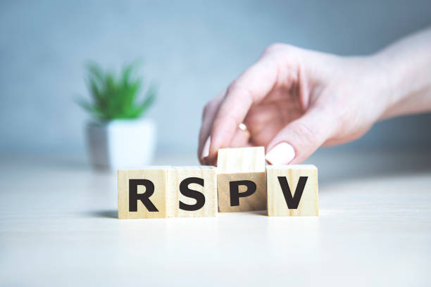 rsvp acronym request for a response from the invited person on wooden cubes with female hand. rsvp acronym request for a response from the invited person on wooden cubes with female hand rsvp stock pictures, royalty-free photos & images