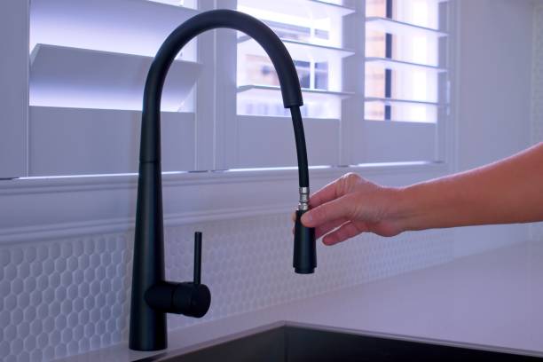Black pull-out kitchen faucet stock photo