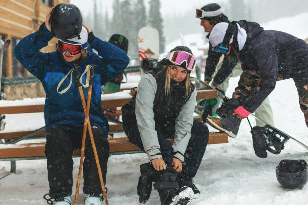 generation z youth skiing and snowboarding activities at ski resort town in the colorado rockies - ski jumping snowboarding snowboard jumping imagens e fotografias de stock