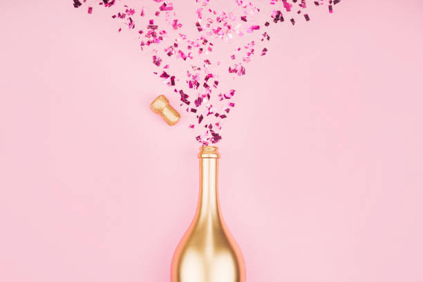 istock Bottle of champagne and confetti. 1212840602