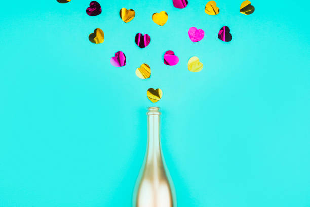 istock Bottle of champagne and confetti. 1212840620