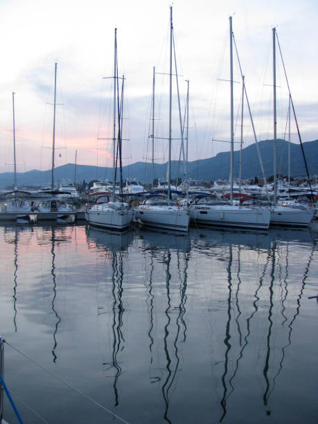istock Yachts without sails in the marina at sunset. 1212840760