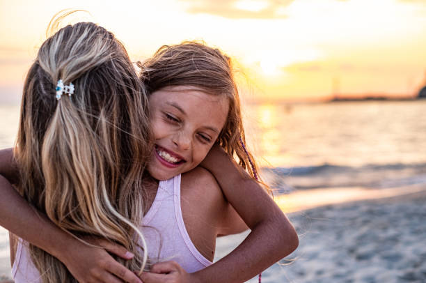 istock Close up mother and daughter hugs 1212841892