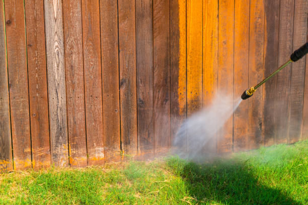 istock Cleaning the fence with a Pressure Washer 1212846673