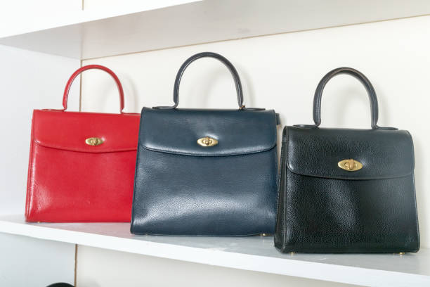 istock vintage leather bag on the white shelf 1212852063