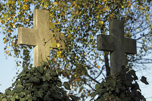 istock Stone cross in a cemetery 121285370