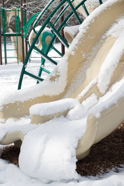 istock A plastic swing covered in snow after a winter snow storm in a public park. 1212853849