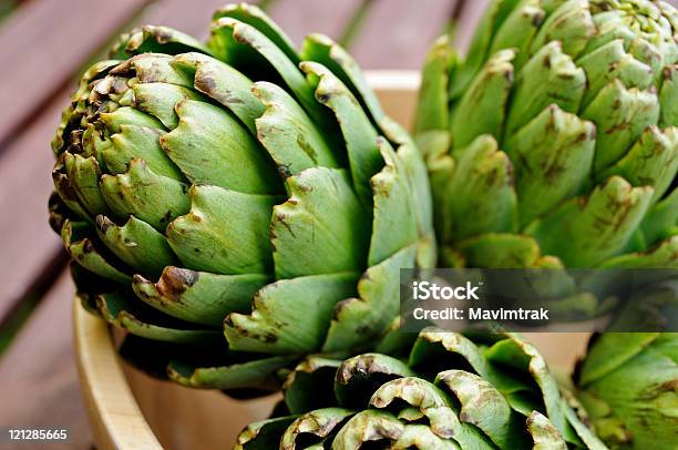 Artichokes In A Bowl Stock Photo - Download Image Now - Artichoke, Basket, Bowl