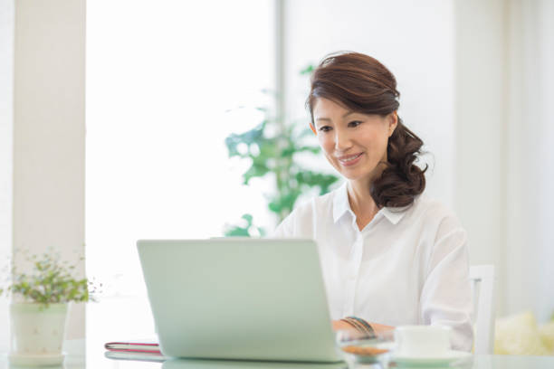 istock Young woman operating a laptop 1212858490
