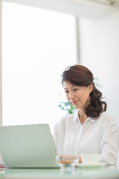 istock Young woman operating a laptop 1212859283