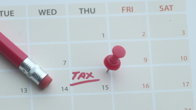 Tax day concept. The USA tax due date marked on the calendar