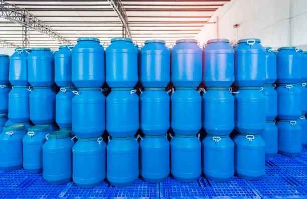 istock Plastic barrels or drums stored in a warehouse 1212863493