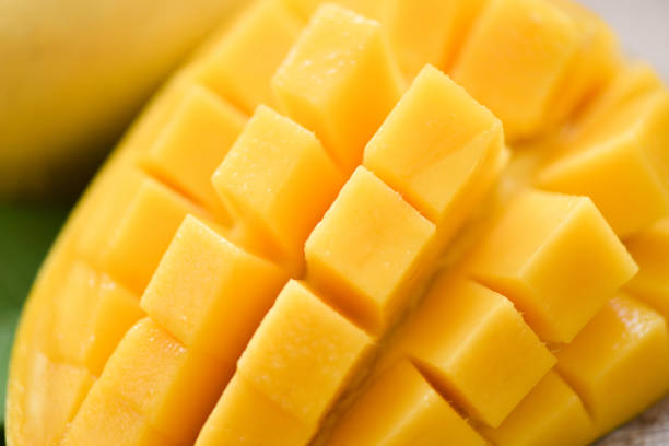 istock Mango slice and mango leaves from tree tropical summer fruit concept - Close up sweet ripe mangos cut 1212866329