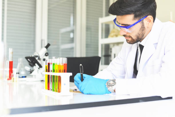 istock Man doctor as male scientist doing some research working conduct experiments in modern laboratory - Scientists in lab biochemistry genetics forensics microbiology and test tube 1212866339