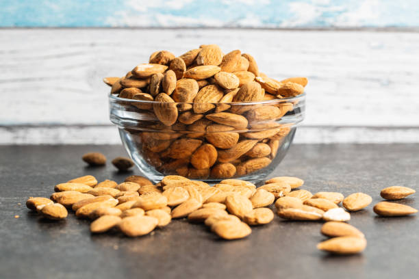 istock Dried almond nuts in bowl. 1212870969
