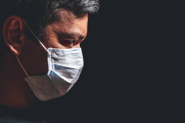istock Profile of man in mask 1212874687