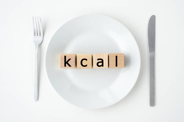 istock Wooden blocks with kcal words on plate 1212874706