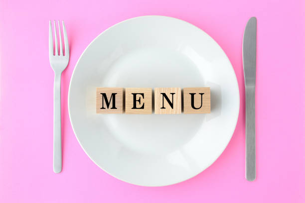 Wooden blocks with MENU words on plate
