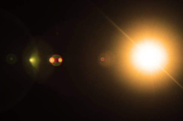 istock Abstract Natural Sun flare or Far star on the black background 1212875564