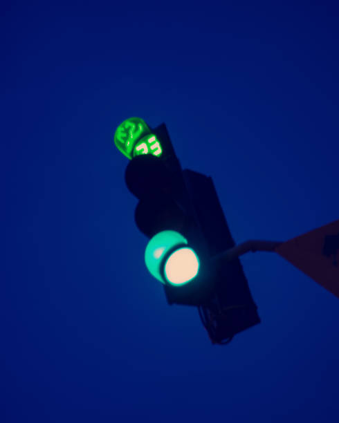 istock Blurred background, green light of traffic light in the night sky. 1212877006