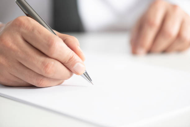 istock Businessman Signing Contract Paper 1212882598