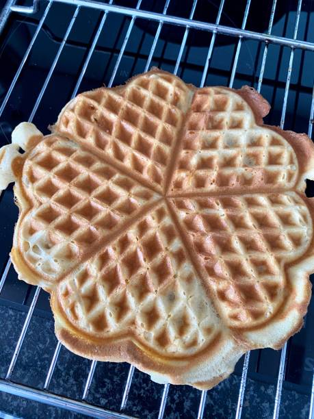 istock Heart shaped waffle on metal grid 1212883709