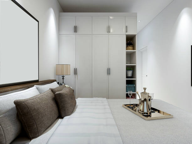 istock 3D rendering, modern design bedroom with large bed, bedside table and other comfortable seating areas 1212884790