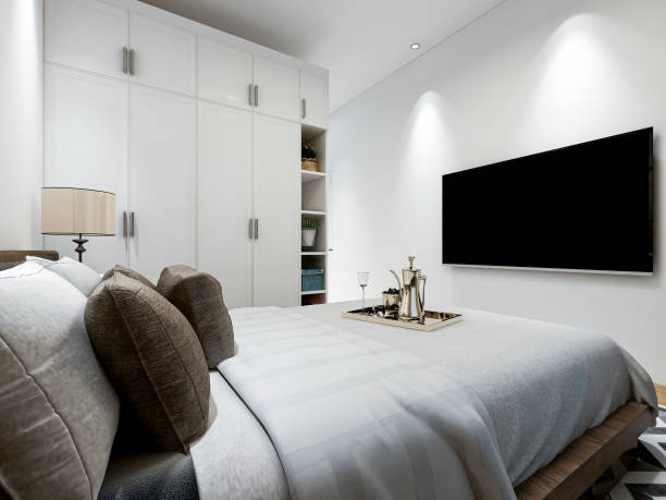 istock 3D rendering, modern design bedroom with large bed, bedside table and other comfortable seating areas 1212884791