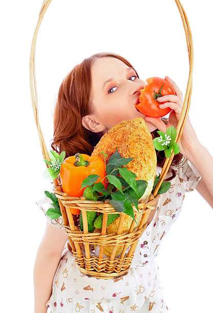istock woman with basket of autumn harvest 121288708