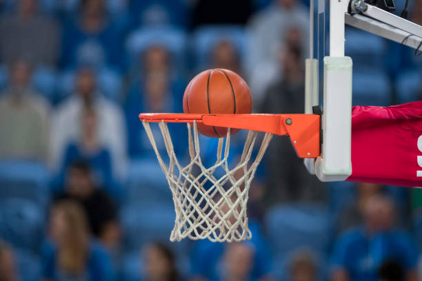istock Basketball reaching to hoop 1212887610