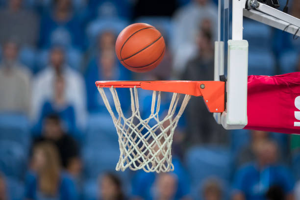 istock Basketball reaching to hoop 1212887614