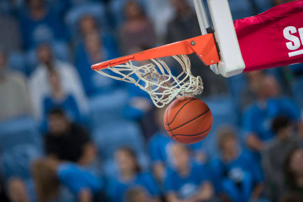 istock Basketball in hoop 1212887615