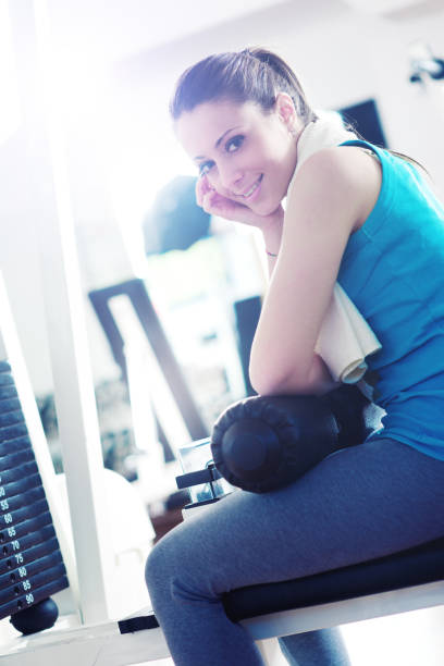 istock Beautiful woman relaxing at gym 1212889241