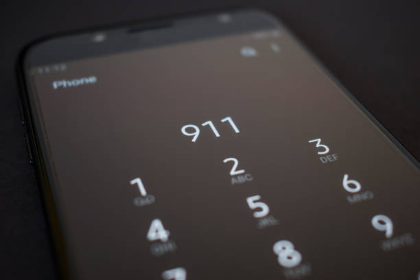istock Close up smartphone calling 911 emergency services number 1212892414