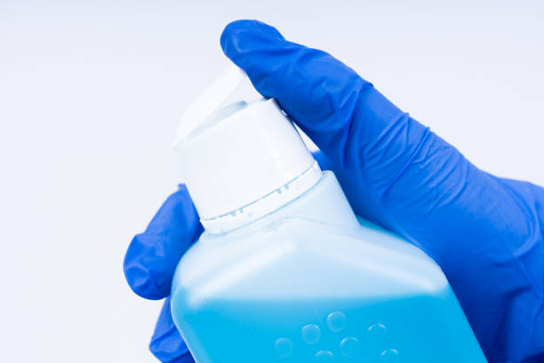 istock Closing a bottle of disinfectant 1212893150