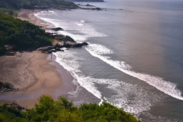 istock Waves in the beach in goa, captured from the sky 1212895903