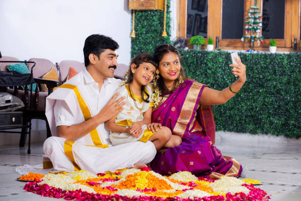 South Indian Young Family with classic look stock photo Indian ethnicity, Indoors, sitting, Traditional clothing, domestic room, traditional festival, south indian lady stock pictures, royalty-free photos & images
