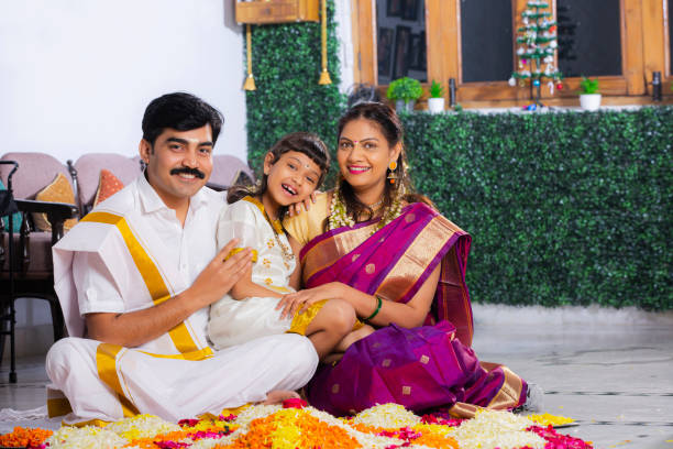 South Indian Young Family with classic look stock photo Indian ethnicity, Indoors, sitting, Traditional clothing, domestic room, traditional festival, happy indian young family couple stock pictures, royalty-free photos & images