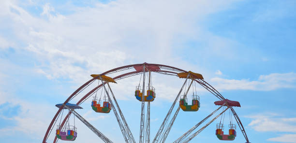 istock A  colorful Ferris wheel with beautiful clouds in the background 1212897775