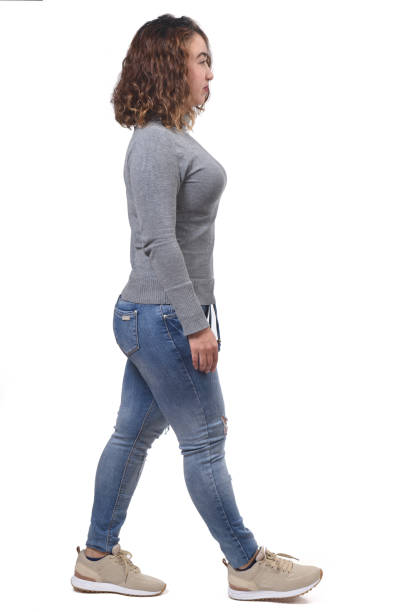 istock woman walking on white background 1212897797