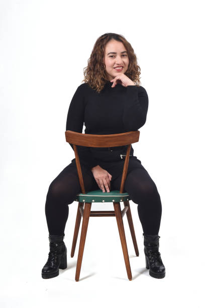 istock woman with chair on white background 1212897847