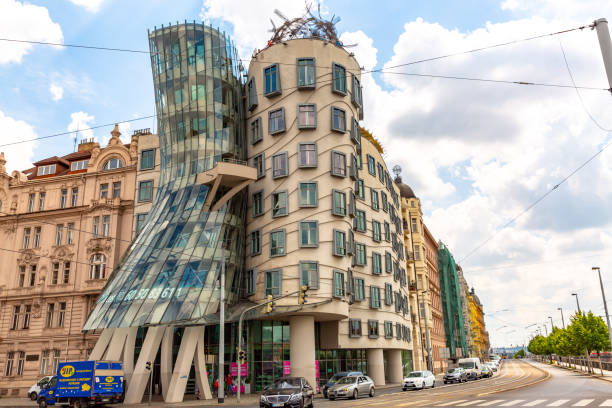 Dancing House in Prague, Czech Republic This pic shows the famous Dancing House in Prague, Czech Republic.Normal street life and tram moving front of  Dancing House (Tančící dům) can be seen in the pic. The pic is taken on 23rd may 2018. dancing house prague stock pictures, royalty-free photos & images