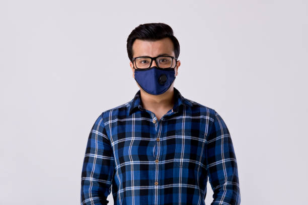istock Man wearing protective face mask to prevent from virus disease 1212903219