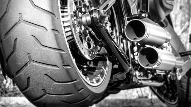 Motorcycle exhaust and rear tire profile close up Motorcycle exhaust and rear tire profile close up new big tube stock pictures, royalty-free photos & images