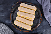 'Ladyfinger', a low density, dry, egg based, sweet sponge biscuits roughly shaped like a large finger, on iron tray